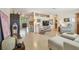 Open living room featuring polished terrazzo floors and seamless flow to other living spaces at 11775 84Th Ave, Seminole, FL 33772