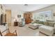 Relaxing living room area showcasing terrazzo floors, and lots of natural light at 11775 84Th Ave, Seminole, FL 33772