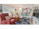 Cozy living room showcasing comfortable seating, unique surfboard decor, and a relaxing atmosphere at 11775 84Th Ave, Seminole, FL 33772