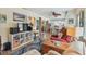 Comfortable living room with open layout, warm seating, and bright connecting dining area at 11775 84Th Ave, Seminole, FL 33772