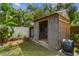 This backyard shed is an ideal storage solution, blending functionality with backyard aesthetics at 11775 84Th Ave, Seminole, FL 33772