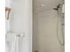 Modern shower equipped with adjustable showerhead and convenient shelving for toiletries, creating a spa-like experience at 11775 84Th Ave, Seminole, FL 33772
