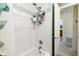Shower with a white subway tile surround and mosaic accent border, including a handheld shower fixture at 11775 84Th Ave, Seminole, FL 33772