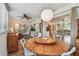 Bright sunroom with unique wood table, lots of natural light, and access to living spaces at 11775 84Th Ave, Seminole, FL 33772