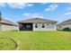 Spacious backyard featuring a screened-in lanai, providing a comfortable outdoor living space at 11785 Little River Way, Parrish, FL 34219