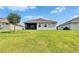 Well-maintained backyard with a screened-in patio, perfect for relaxing and enjoying the outdoors at 11785 Little River Way, Parrish, FL 34219