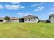Expansive backyard with a screened-in patio, offering ample space for outdoor activities and leisure at 11785 Little River Way, Parrish, FL 34219