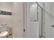 Bright and clean bathroom featuring a toilet, shower with glass door, and neutral decor at 11785 Little River Way, Parrish, FL 34219