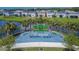 Outdoor fitness park with various exercise equipment, surrounded by lush landscaping and homes at 11785 Little River Way, Parrish, FL 34219