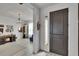 Inviting entryway featuring a modern front door with sidelight and a view into a bright living space at 11785 Little River Way, Parrish, FL 34219