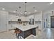 Well-equipped kitchen featuring ample counter space, stainless steel appliances, and a large island at 11785 Little River Way, Parrish, FL 34219