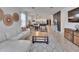 Open concept living spaces with decor and view of kitchen and dining room at 11785 Little River Way, Parrish, FL 34219