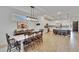 Open concept living spaces with view of kitchen at 11785 Little River Way, Parrish, FL 34219