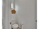 Powder room showcasing a modern toilet, stylish wallpaper, and decorative accents at 11785 Little River Way, Parrish, FL 34219