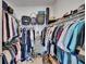 Walk-in closet with double hanging racks, shelves, and floor-to-ceiling storage space at 11785 Little River Way, Parrish, FL 34219