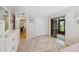 Bedroom with a sliding glass door to the patio, large rug, and dresser at 11809 Raintree Lake Ln # A, Tampa, FL 33617