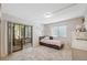 Bright bedroom with a sliding glass door to the patio and a daybed at 11809 Raintree Lake Ln # A, Tampa, FL 33617