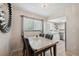Dining room with stylish mirror, table with marble top, and tile flooring at 11809 Raintree Lake Ln # A, Tampa, FL 33617