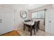 Dining room with stylish lighting, table with marble top, and tile flooring at 11809 Raintree Lake Ln # A, Tampa, FL 33617
