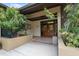 The entrance to the clubhouse is accented by decorative plants and complemented by double doors at 11809 Raintree Lake Ln # A, Tampa, FL 33617