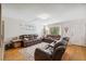 Cozy living room featuring plush leather seating and lots of natural light at 11809 Raintree Lake Ln # A, Tampa, FL 33617