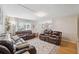 Cozy living room featuring plush leather seating and lots of natural light at 11809 Raintree Lake Ln # A, Tampa, FL 33617
