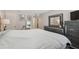 Spacious main bedroom featuring carpet floors, a queen bed, and stylish furnishings at 11809 Raintree Lake Ln # A, Tampa, FL 33617