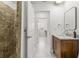 Bathroom featuring modern design, tiled shower, and wooden cabinet at 1191 Darlington Oak Ne Dr, St Petersburg, FL 33703