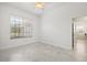A bright, airy bedroom features a large window and modern flooring at 1191 Darlington Oak Ne Dr, St Petersburg, FL 33703