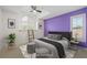 Staged bedroom with a ladder leading to an arched window at 1191 Darlington Oak Ne Dr, St Petersburg, FL 33703