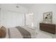 Staged bedroom with a neutral palette, closet and furniture at 1191 Darlington Oak Ne Dr, St Petersburg, FL 33703