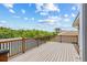 Outdoor deck boasting scenic views of lush greenery and blue skies for serene relaxation at 1191 Darlington Oak Ne Dr, St Petersburg, FL 33703