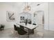 Bright dining room with modern light fixture and elegant marble table, perfect for gatherings at 1191 Darlington Oak Ne Dr, St Petersburg, FL 33703
