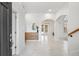 Inviting foyer showcasing archways, modern console, and stylish tile flooring at 1191 Darlington Oak Ne Dr, St Petersburg, FL 33703