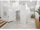 Bright foyer with white walls, tile floors, and a view into other rooms at 1191 Darlington Oak Ne Dr, St Petersburg, FL 33703
