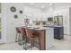 Modern kitchen with stainless steel appliances, marble countertops, stylish island with bar stool seating at 1191 Darlington Oak Ne Dr, St Petersburg, FL 33703