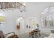 Bright open-concept space with high ceilings, archways, and tile flooring at 1191 Darlington Oak Ne Dr, St Petersburg, FL 33703