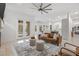 Inviting living room with stylish decor, comfortable seating, french doors and seamless access to outdoor pool at 1191 Darlington Oak Ne Dr, St Petersburg, FL 33703