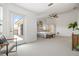 Main bedroom with an outdoor balcony offers plenty of space, natural light, and neutral carpeting at 1191 Darlington Oak Ne Dr, St Petersburg, FL 33703