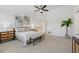 The main bedroom is bright and spacious with a ceiling fan and neutral carpeting at 1191 Darlington Oak Ne Dr, St Petersburg, FL 33703