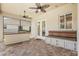 Covered patio featuring an outdoor kitchen with a built-in grill at 1191 Darlington Oak Ne Dr, St Petersburg, FL 33703