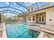 Sparkling screened-in pool and hot tub with a view of the home at 1191 Darlington Oak Ne Dr, St Petersburg, FL 33703