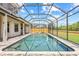 Long screened-in pool with a view of the home at 1191 Darlington Oak Ne Dr, St Petersburg, FL 33703