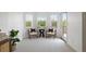 Sitting area features decorative pillows on chairs and has access to an outdoor balcony at 1191 Darlington Oak Ne Dr, St Petersburg, FL 33703