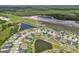 Scenic aerial view showcases a well-planned community nestled around picturesque lakes and natural surroundings at 12481 Aston Dr, Hudson, FL 34669
