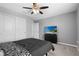 Bedroom with a ceiling fan, closet and television at 12481 Aston Dr, Hudson, FL 34669