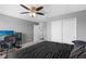 Cozy gray bedroom featuring a ceiling fan, natural light, and a comfortable bed at 12481 Aston Dr, Hudson, FL 34669