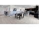 Open concept kitchen and dining area featuring tile floors, stainless steel appliances and ample counter space at 12481 Aston Dr, Hudson, FL 34669