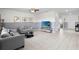 Bright living room boasting tile floors, a modern color scheme, and comfortable seating, creating an inviting space at 12481 Aston Dr, Hudson, FL 34669