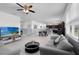 Spacious living area features tile flooring, neutral paint scheme, and an open layout perfect for entertaining guests at 12481 Aston Dr, Hudson, FL 34669